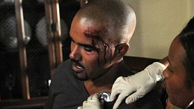 Derek Morgan with a bleeding head