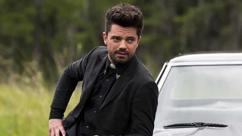 Jesse Custer leaning on a car