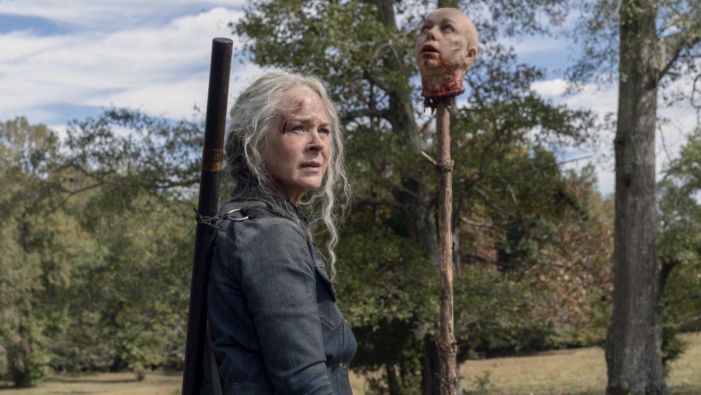 Carol (Martina McBride) looks at Alpha's head on The Walking Dead