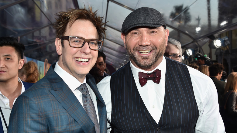 James Gunn and Dave Bautista smiling at premiere