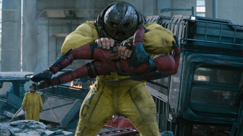 Juggernaut holding Deadpool sideways