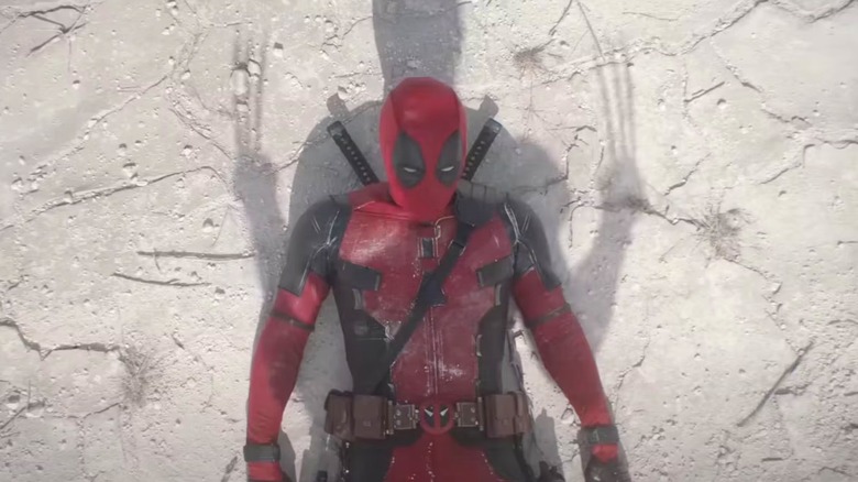 Deadpool looking at Wolverine