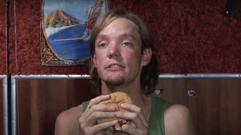 Matthew Lillard as Shaggy eating a burger in Scooby-Doo