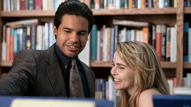 Miguel and Lindsey smile at the library