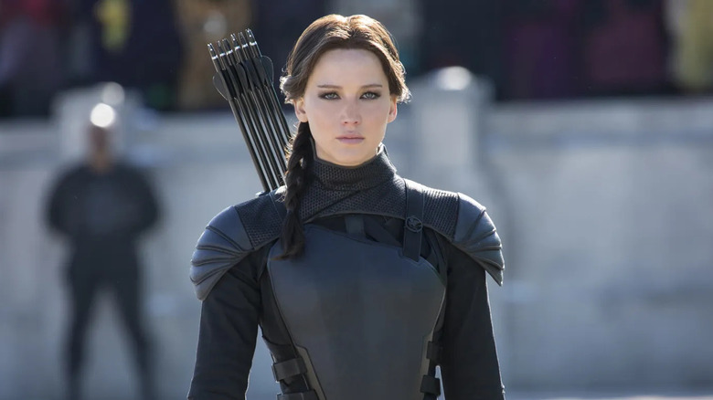 Katniss with arrows strapped to her back in The Hunger Games: Mockingjay