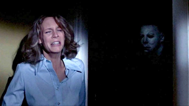 Laurie hiding from Michael Myers