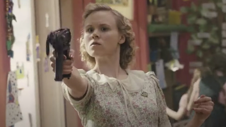 Teacher pointing a gun in Snowpiercer