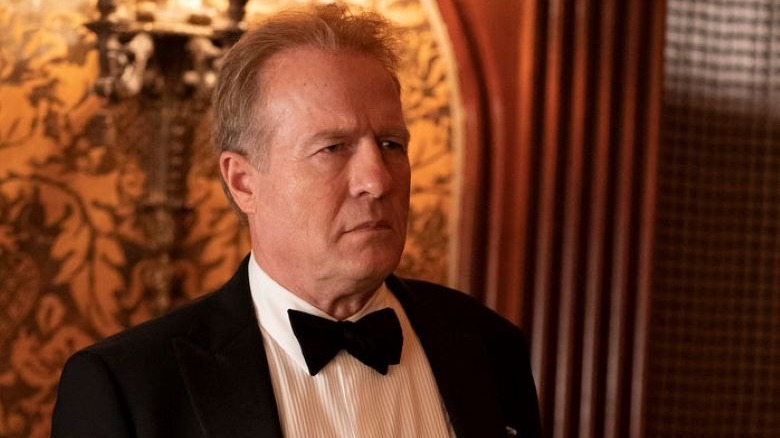 Gregg Henry scowling