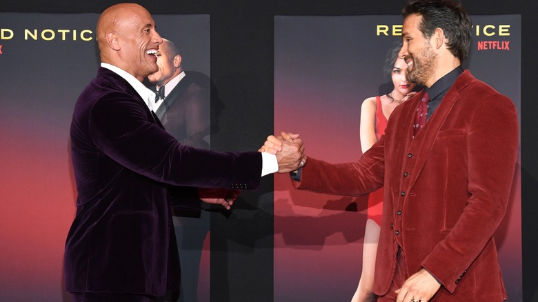 Dwayne Johnson and Ryan Reynolds laughing