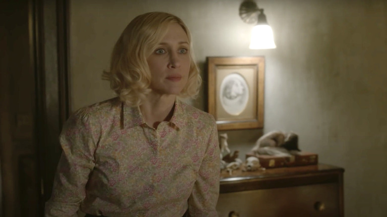 Norma Bates standing in bedroom