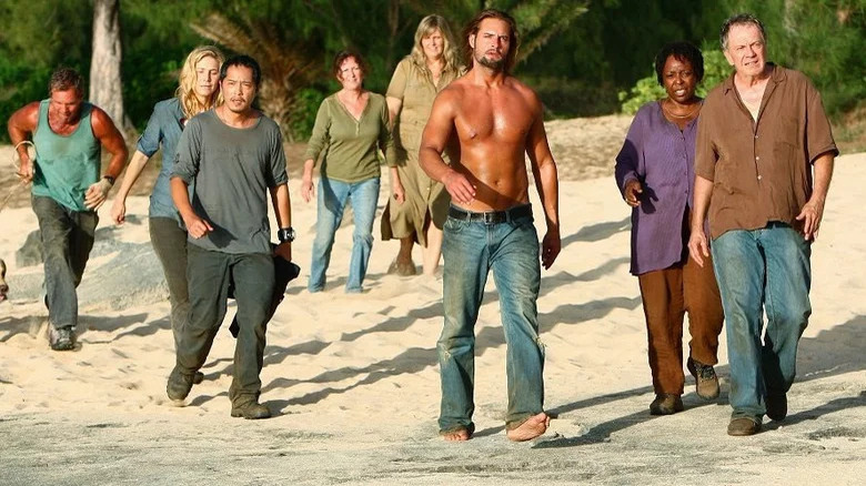 Lost cast standing on beach