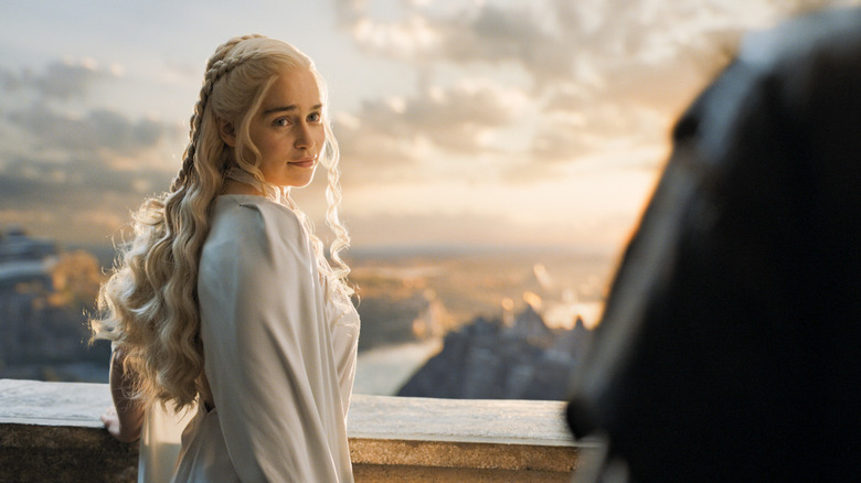 Daenerys smiling and looking back