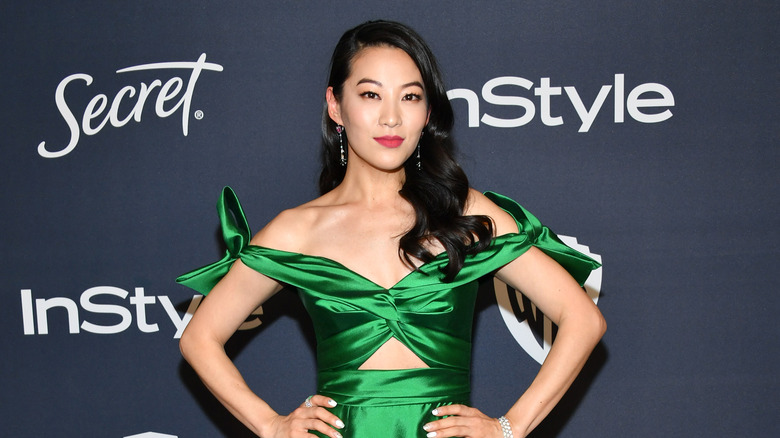 Arden Cho posing at event 