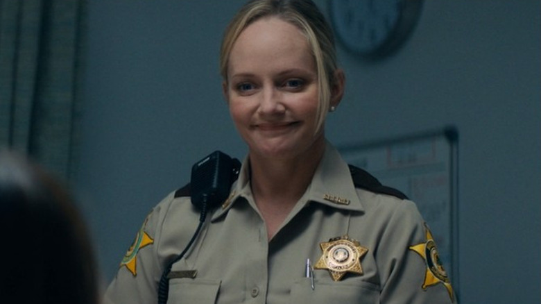 Judy smiling police uniform