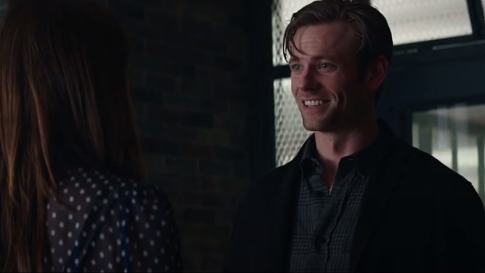 Eric Johnson grinning in 50 Shades Darker