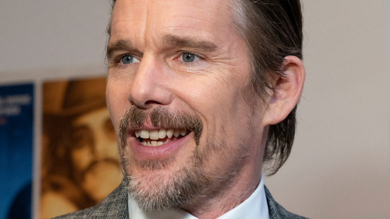 Ethan Hawke smiling off camera