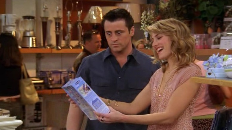 Joey Tribbiani looking at a box