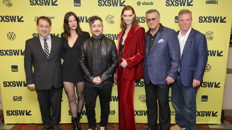 Sam Raimi, Lily Sullivan, Lee Cronin, Alyssa Sutherland, Bruce Campbell and Robert Tapert posing at premiere