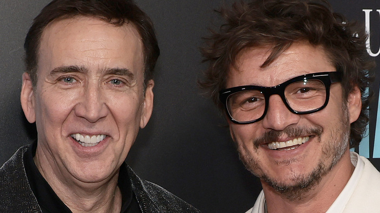 Nicolas Cage and Pedro pascal at event smiling