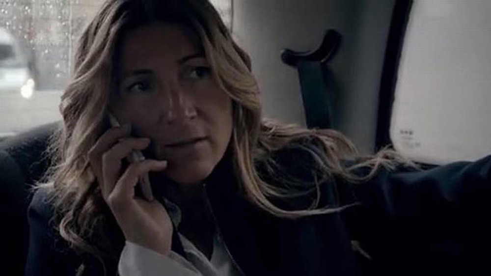 Eve Best in car on phone