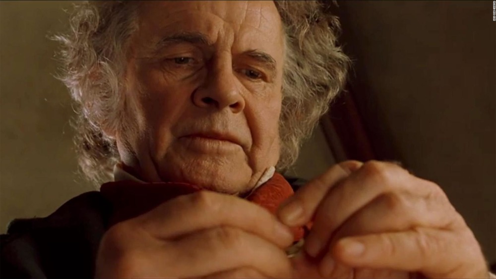 Older Bilbo Baggins holding One Ring