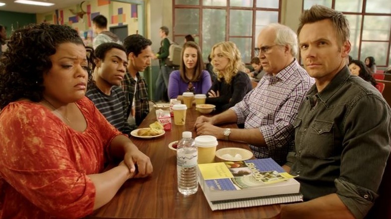 The cast of community at a lunch table