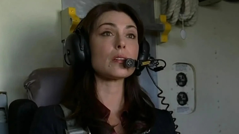 Woman sits in helicopter