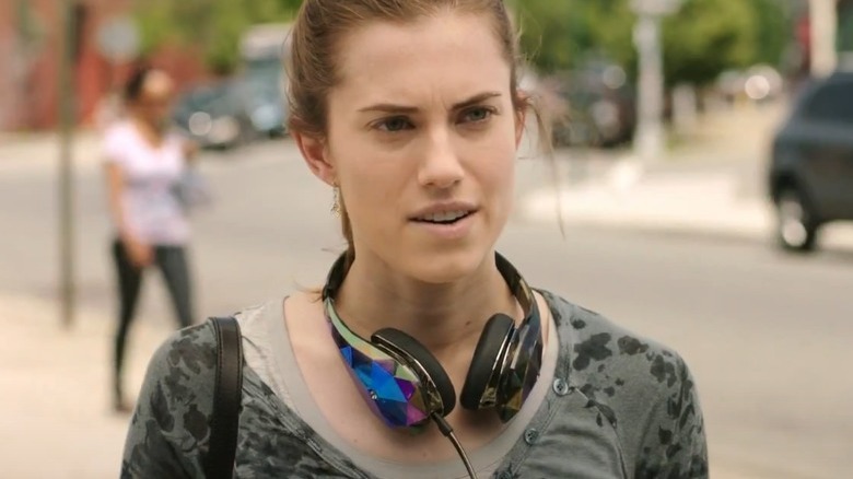 Marnie looking surprised, wearing headphones around her neck