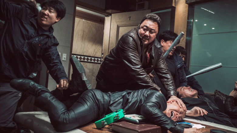 Ma Seok-do roughing up a suspect