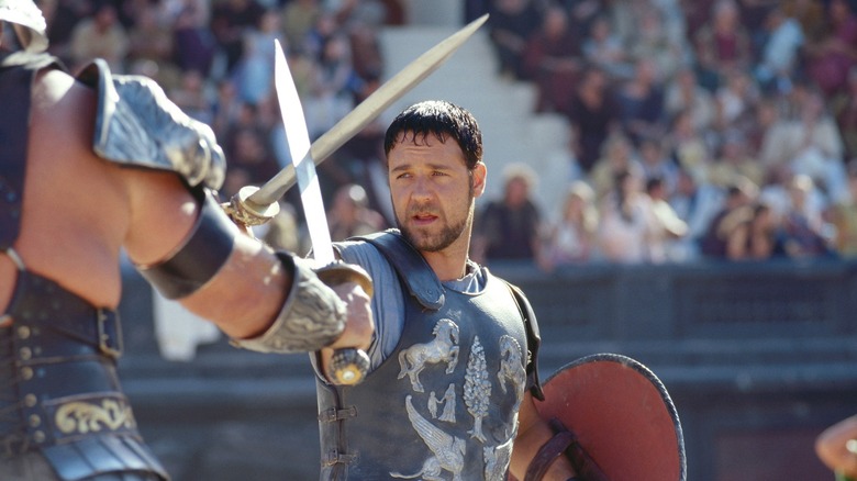 Maximus clashing swords with a foe