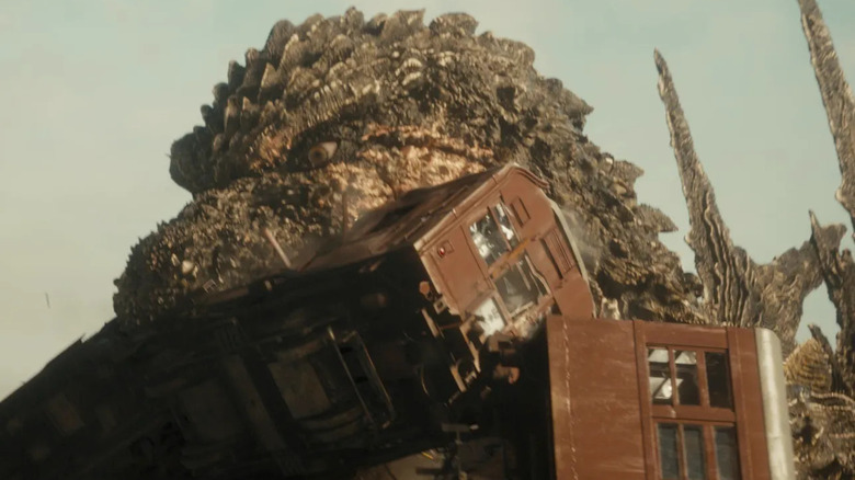 Godzilla destroying train