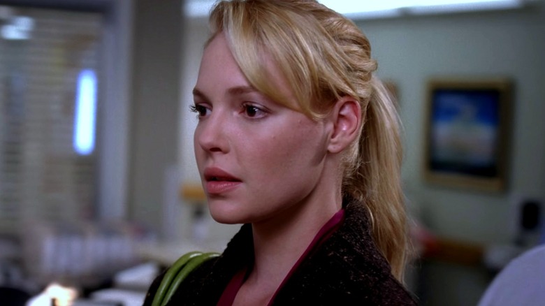 Izzie Stevens looking to the left