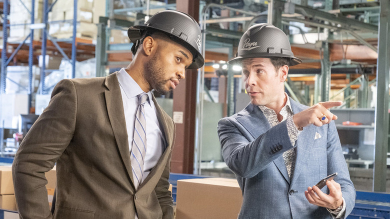 Tye White and Jon Barinholtz in hard hats 