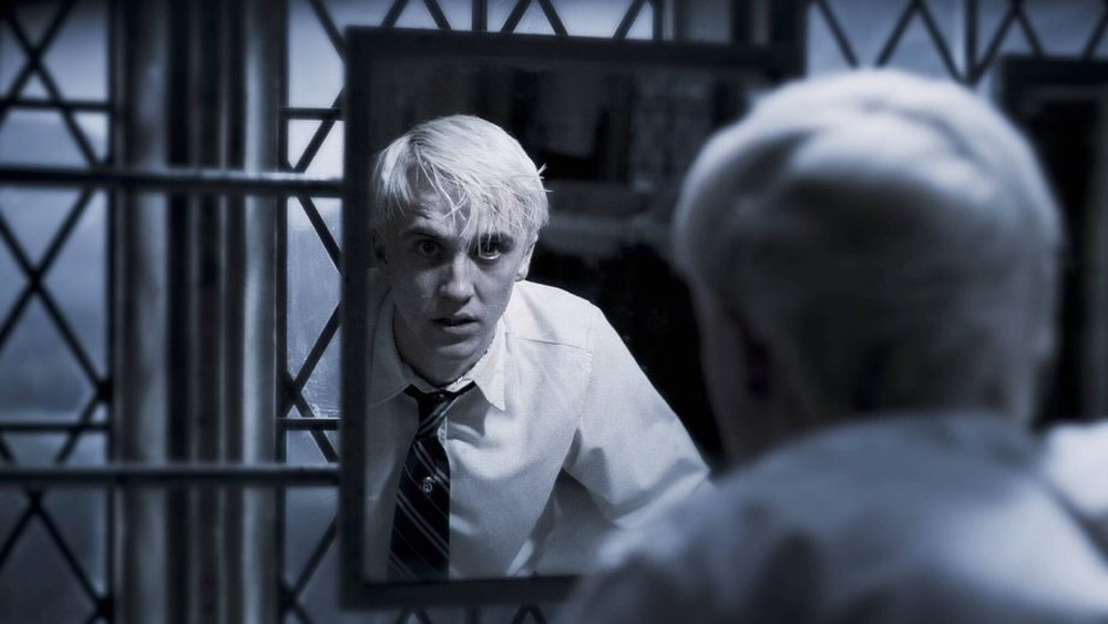 Draco Malfoy looking into mirror