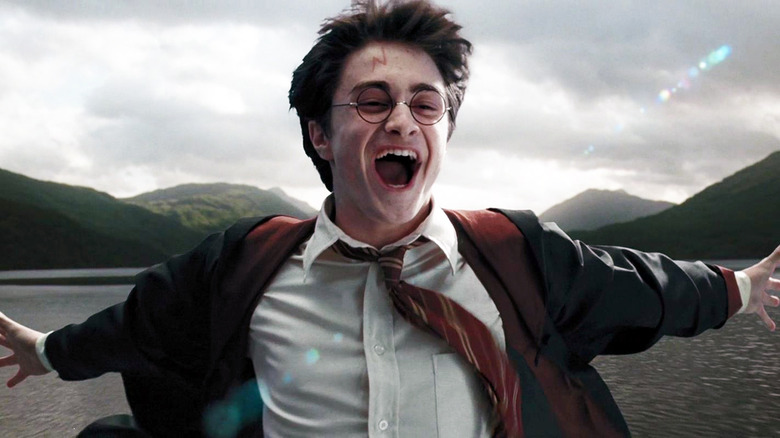 Harry Potter laughing by lake