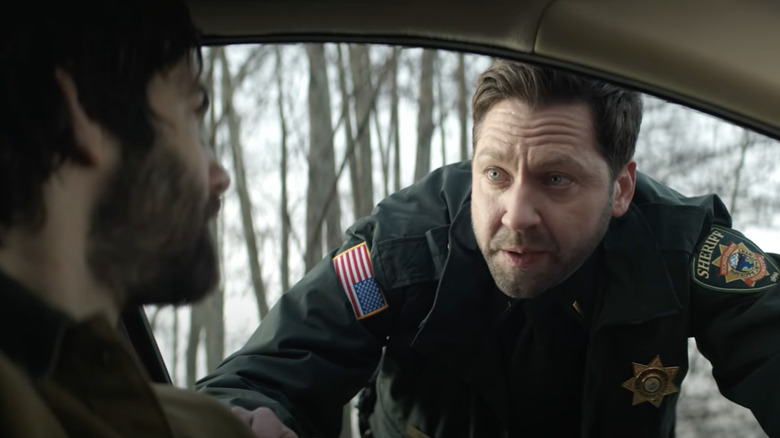 Lt. Frank Briggs Jr. leaning in car window