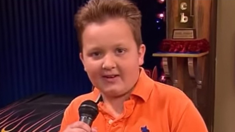 Gibby holding microphone