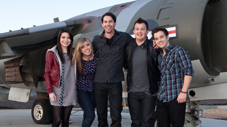 iCarly stars standing by plane