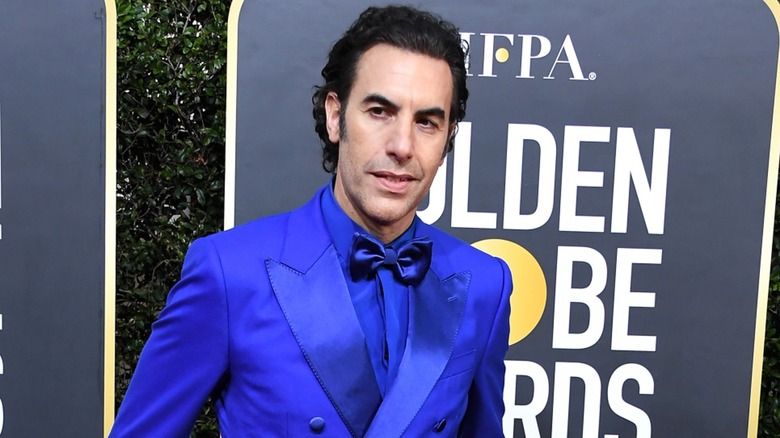 Sacha Baron Cohen smiling blue suit