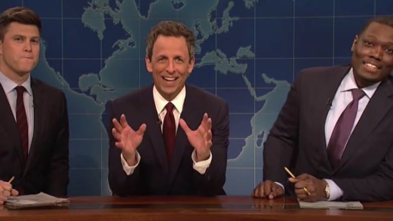 Colin Jost, Seth Meyers, and Michael Che hosting "Weekend Update"