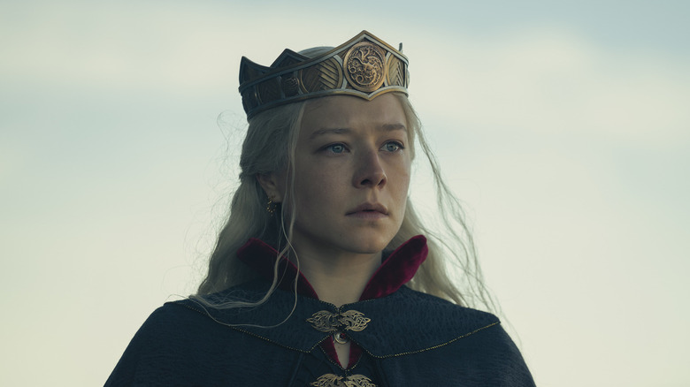 Queen Rhaenyra Targaryen standing outside