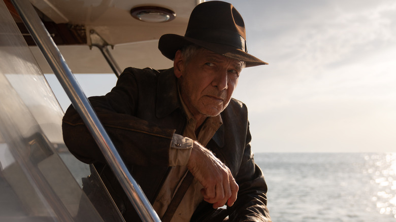 Indiana Jones leaning on boat