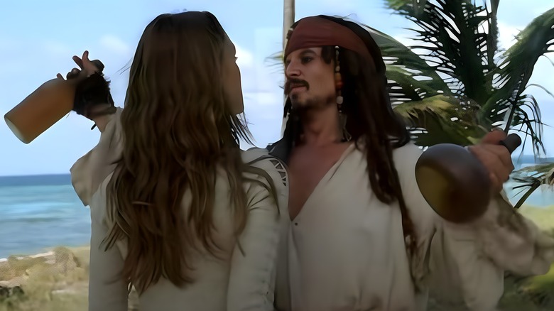 Jack Sparrow holding bottles of rum