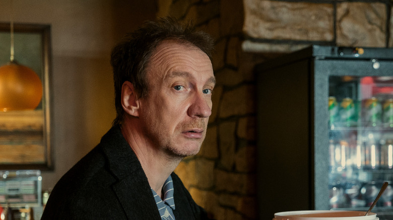 David Thewlis as John Dee staring off.