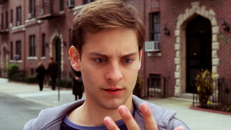 Peter Parker looks at hand