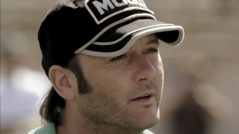 Tim McGraw wearing a hat as Charles Billingsley in Friday Night Lights