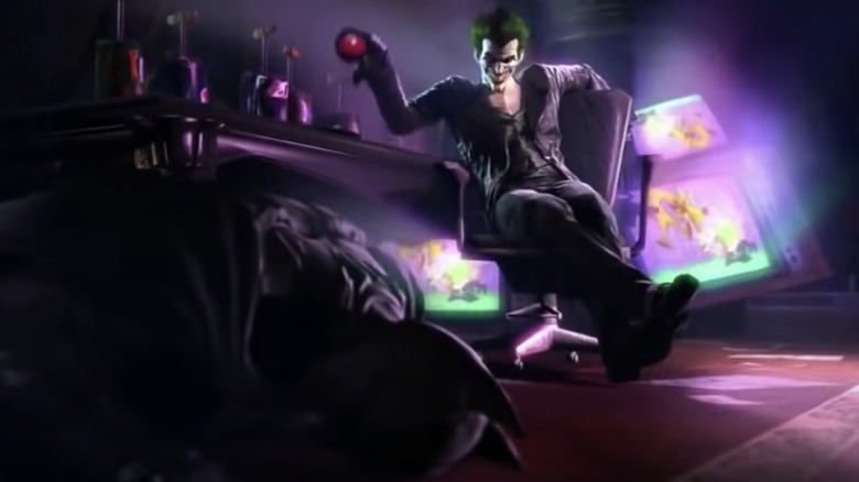 The Joker over a fallen Batman in Batman: Arkham Origins