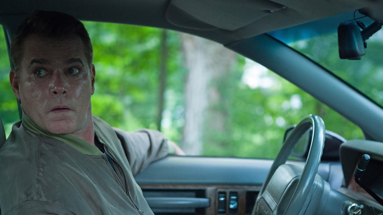 Ray Liotta sitting in a car