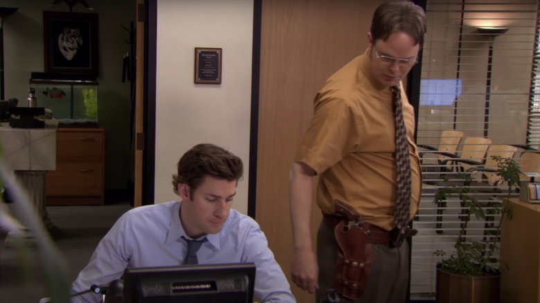 Dwight checking on Jim's work