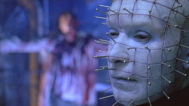 Pinhead with a corpse in background